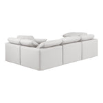 Indulge 105" Vegan Leather Upholstered 4pc. Modular Sectional in Cream